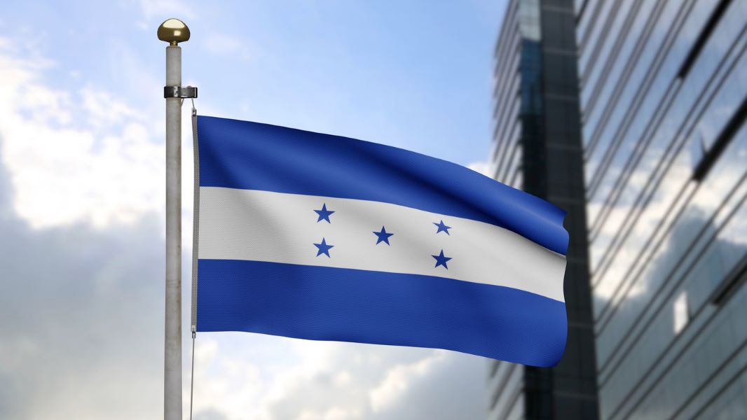 Honduras flag waving with a building in the background
